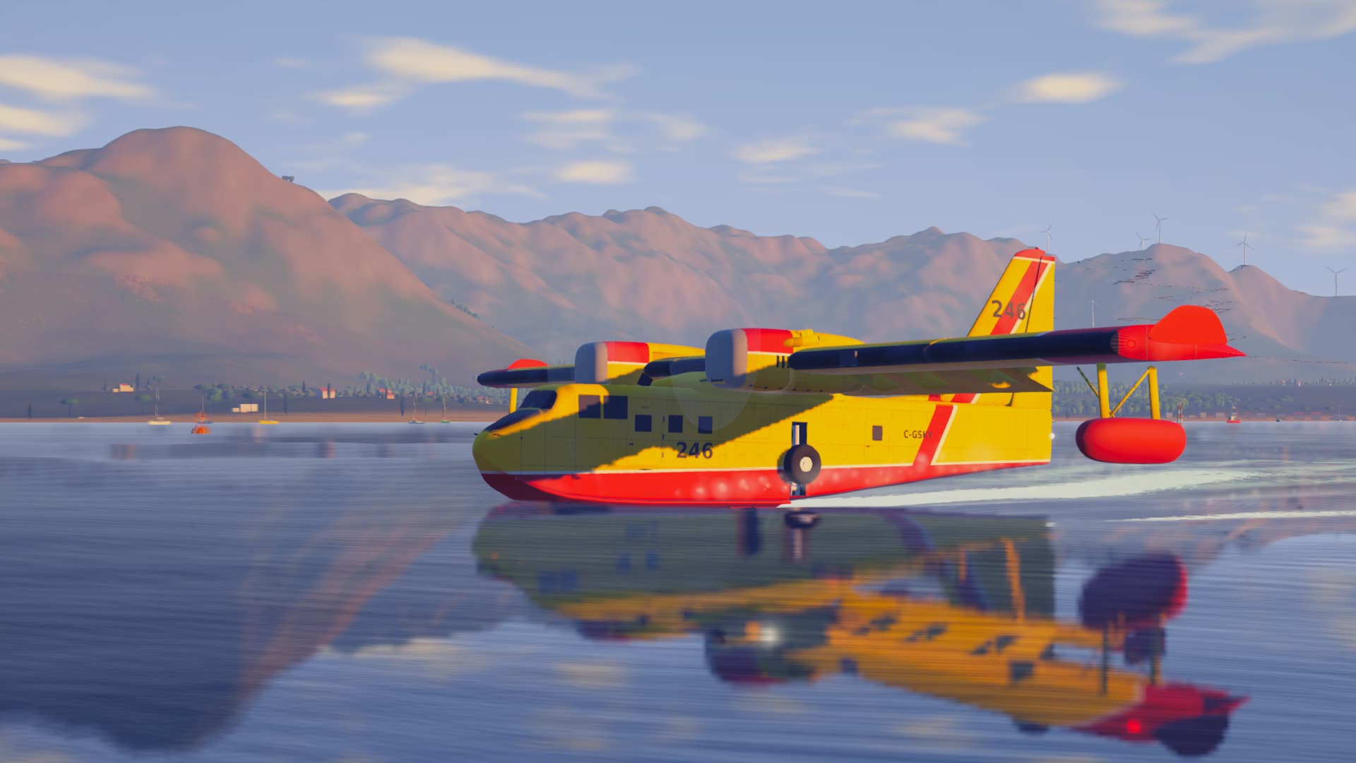 Scooping: the aircraft skims the bay on its hull, spray trailing, mirrored in the water.